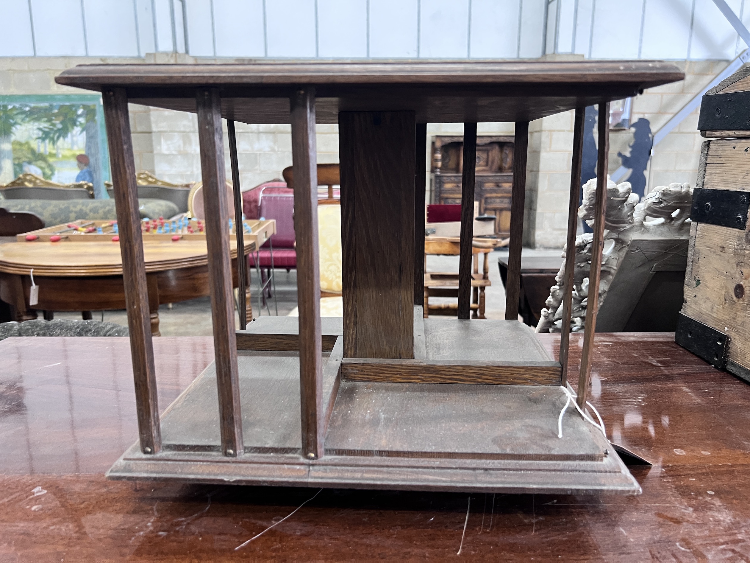 An Edwardian oak table top revolving bookcase, width 37cm, height 31cm